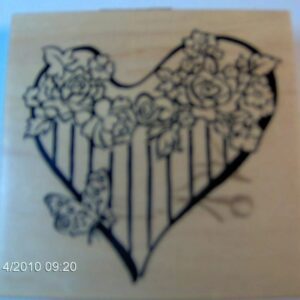 A heart with flowers on it's side.