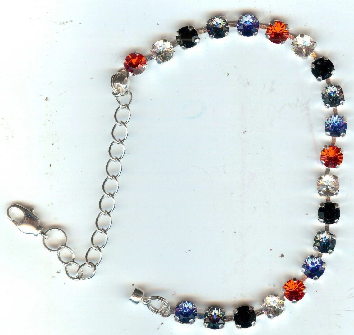 A silver chain with colorful beads on it.