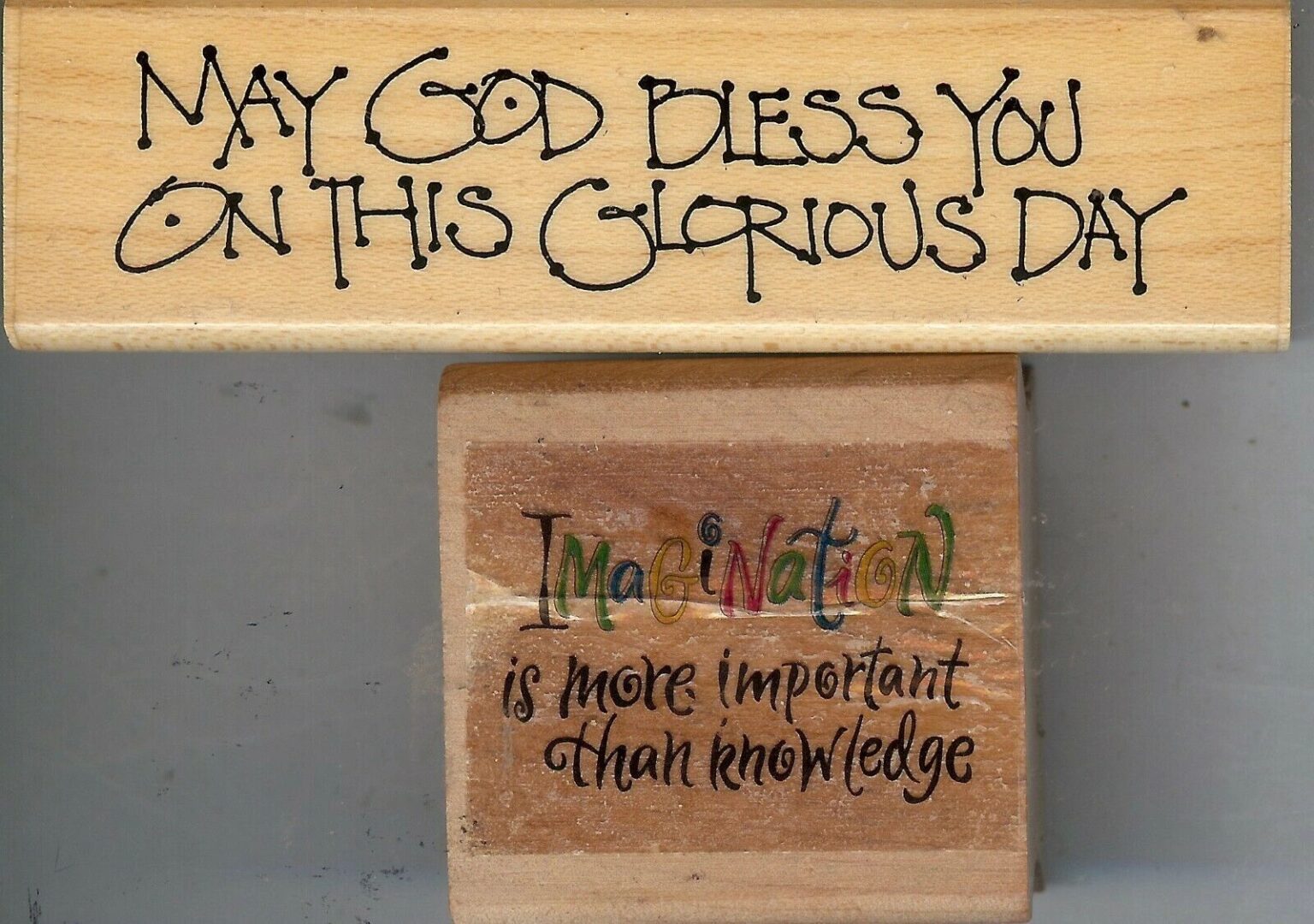 A wooden block with some writing on it