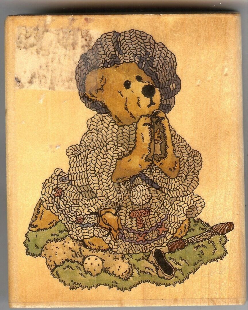 A teddy bear is sitting in front of some eggs.