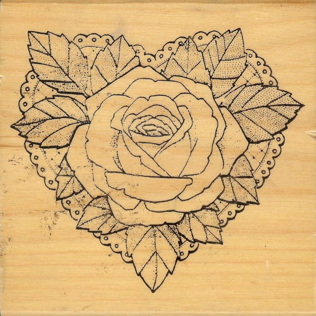 A rose is drawn on the heart with leaves.