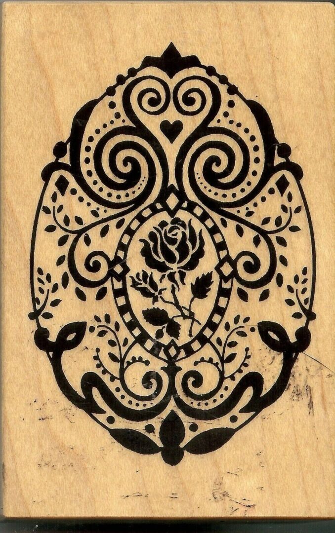 A black and white picture of an ornate design.