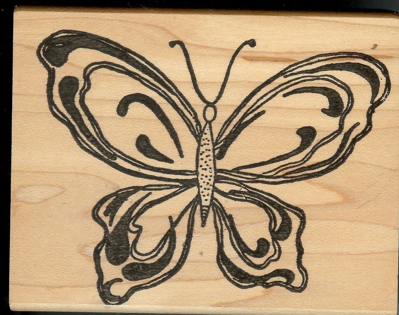 A butterfly is drawn on the wood.