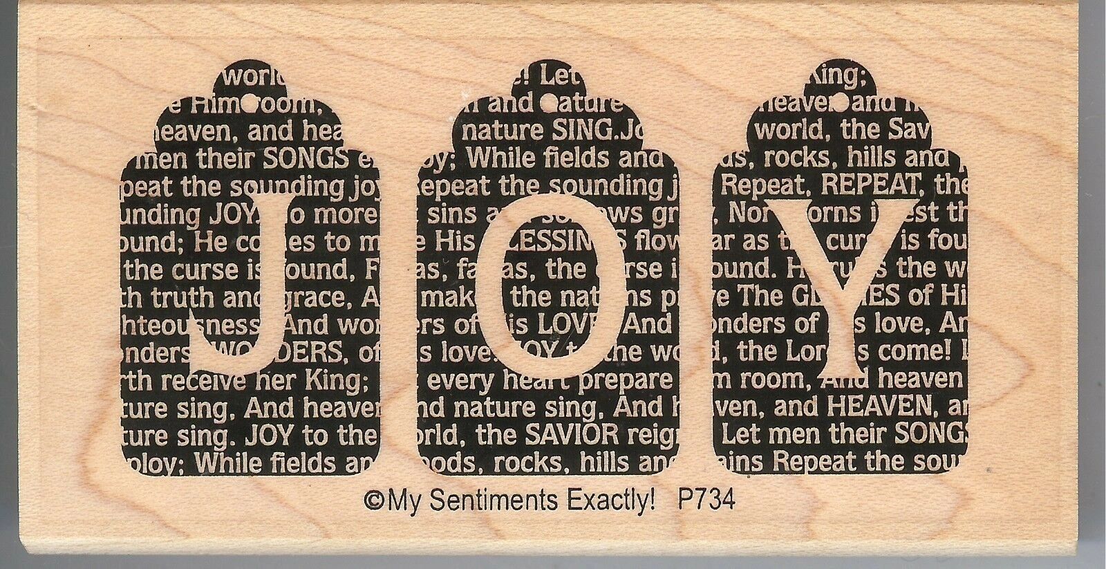 A wooden plaque with words that say " joy ".
