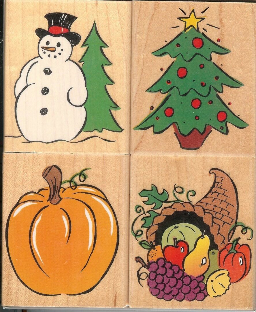 A set of four wooden blocks with different pictures on them.
