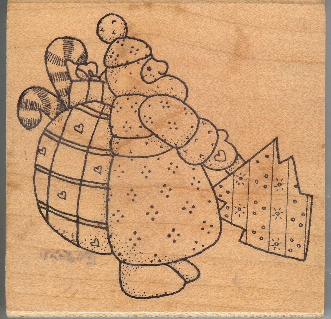 A wooden picture of a bear holding a bag