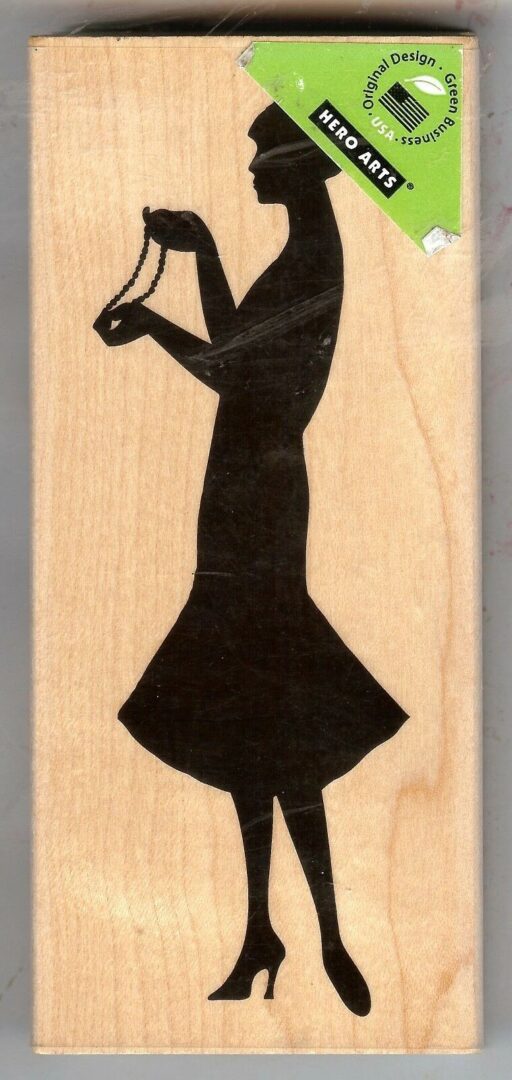 A woman in black dress holding a microphone.