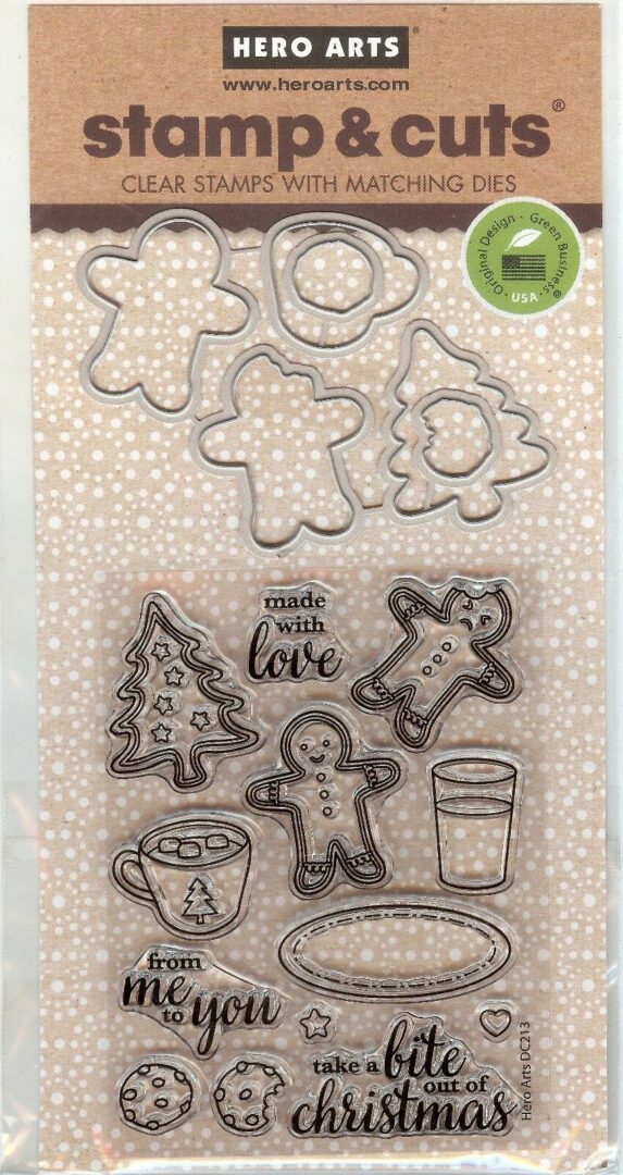 A set of cookie cutters and a cup on a card.