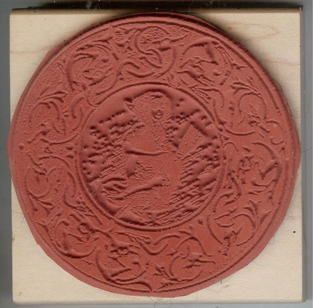 A red rubber stamp with a picture of a person in the center.