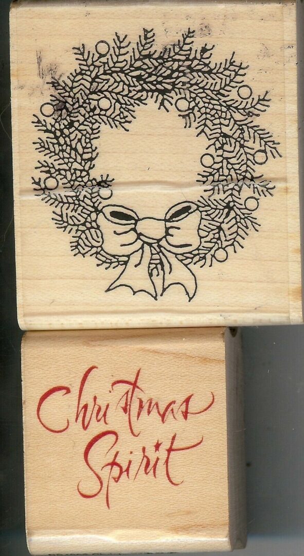 A wooden block with the word christmas written on it.