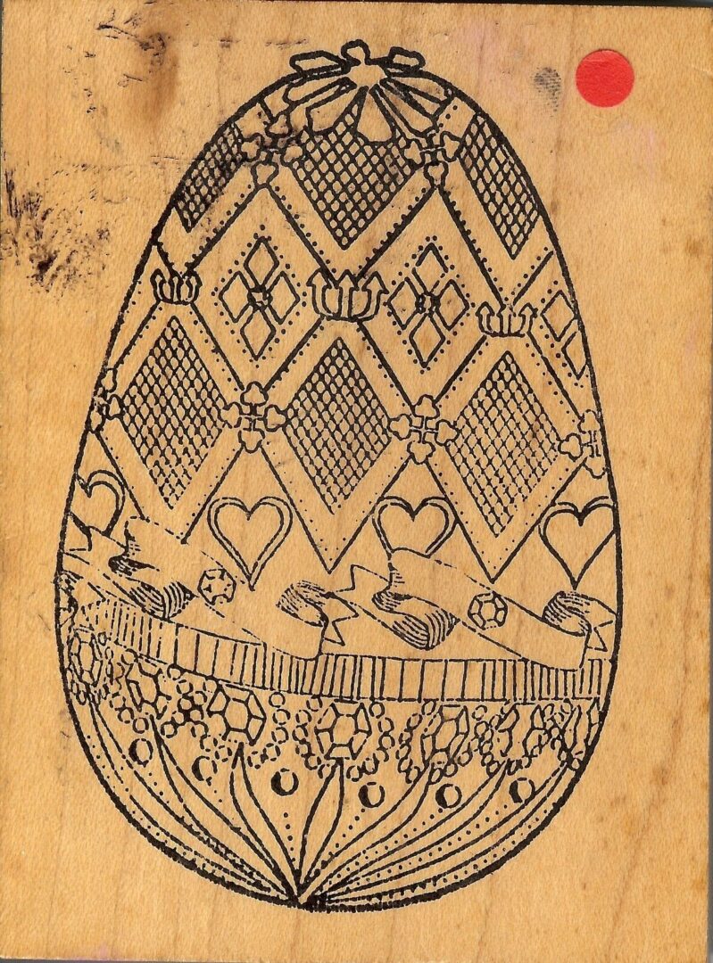 A drawing of an egg with hearts and flowers.