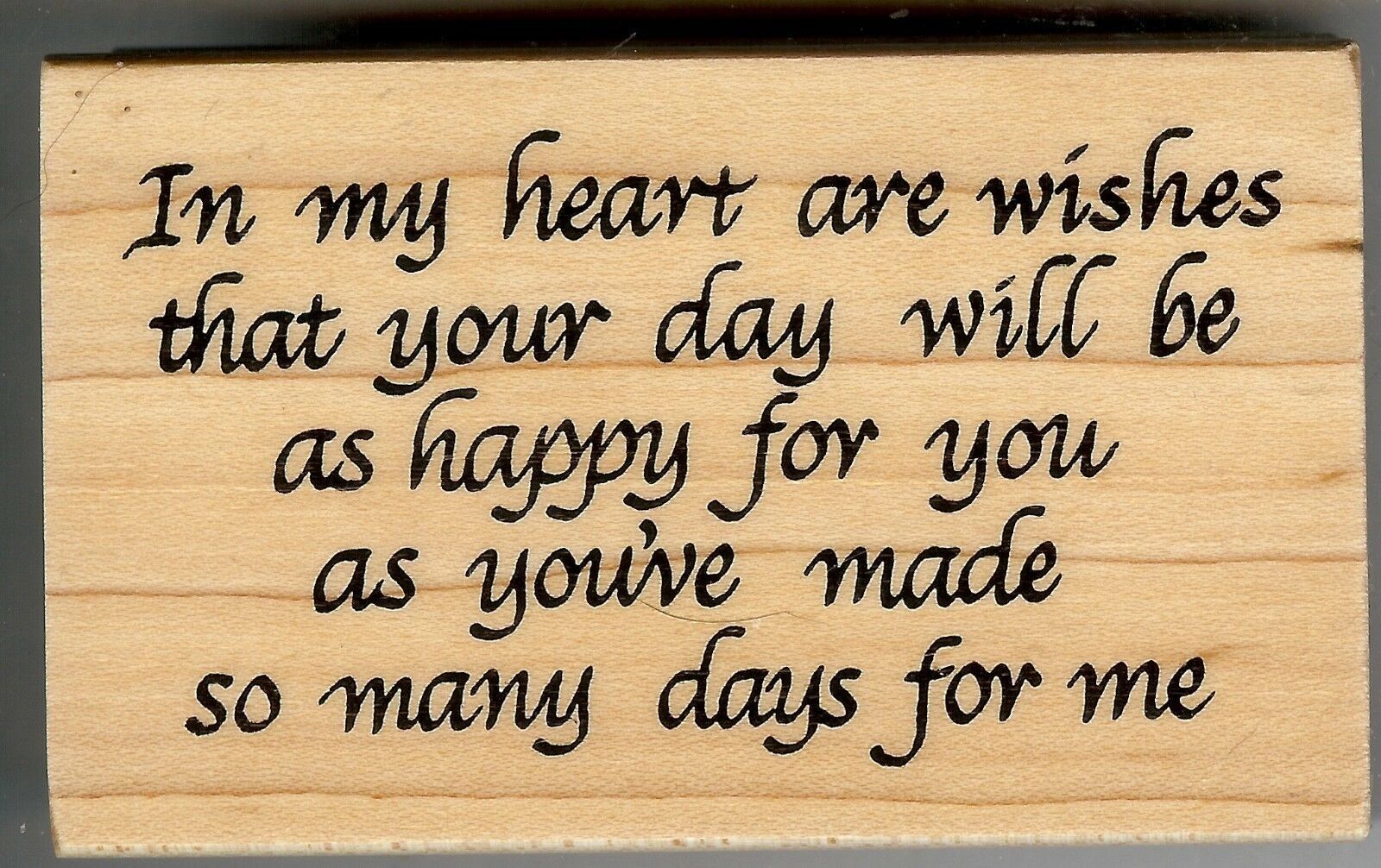 A wooden stamp with the words " my heart are wishing for you ".