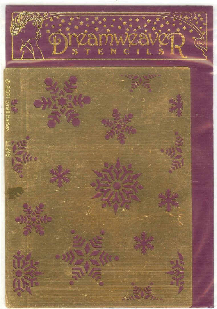 A purple and gold stencil with snowflakes on it.