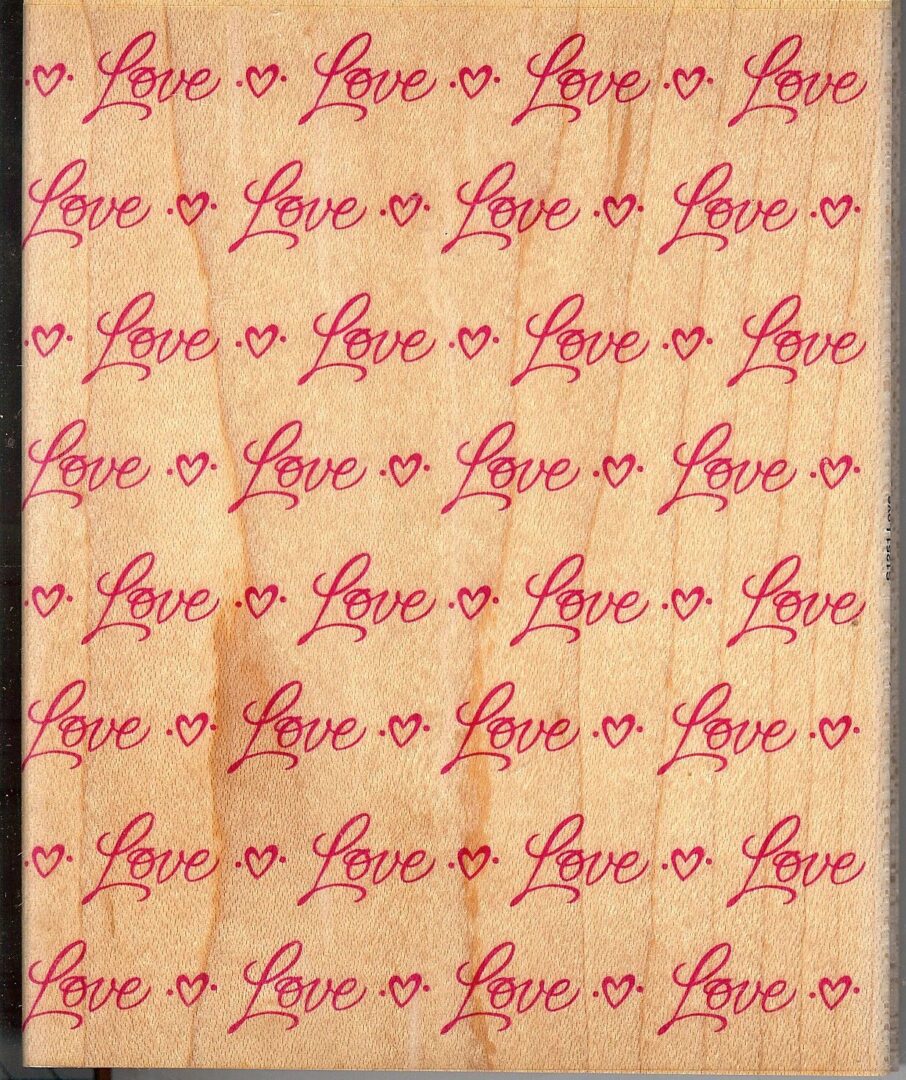 A sheet of paper that has the word love written on it.